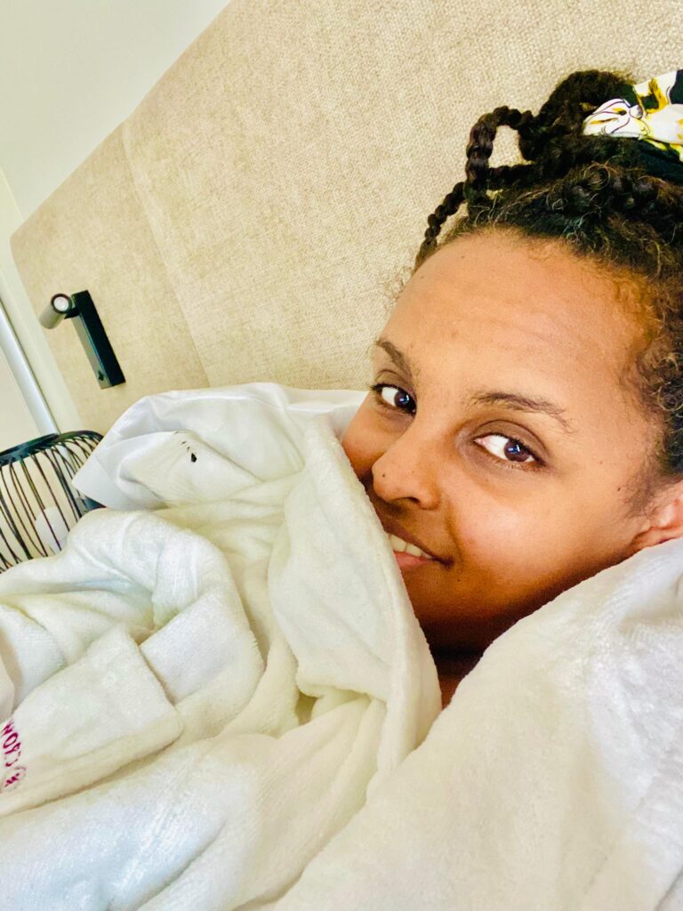 best advice from therapy, black woman in a hotel gown looking happy