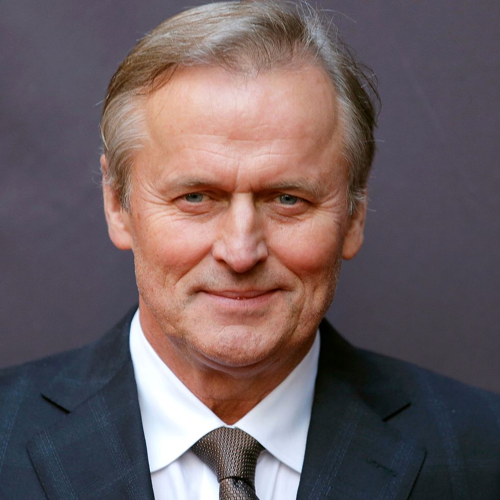 Picture of John Grisham's profile, in a suit. Related to changing careers late in life