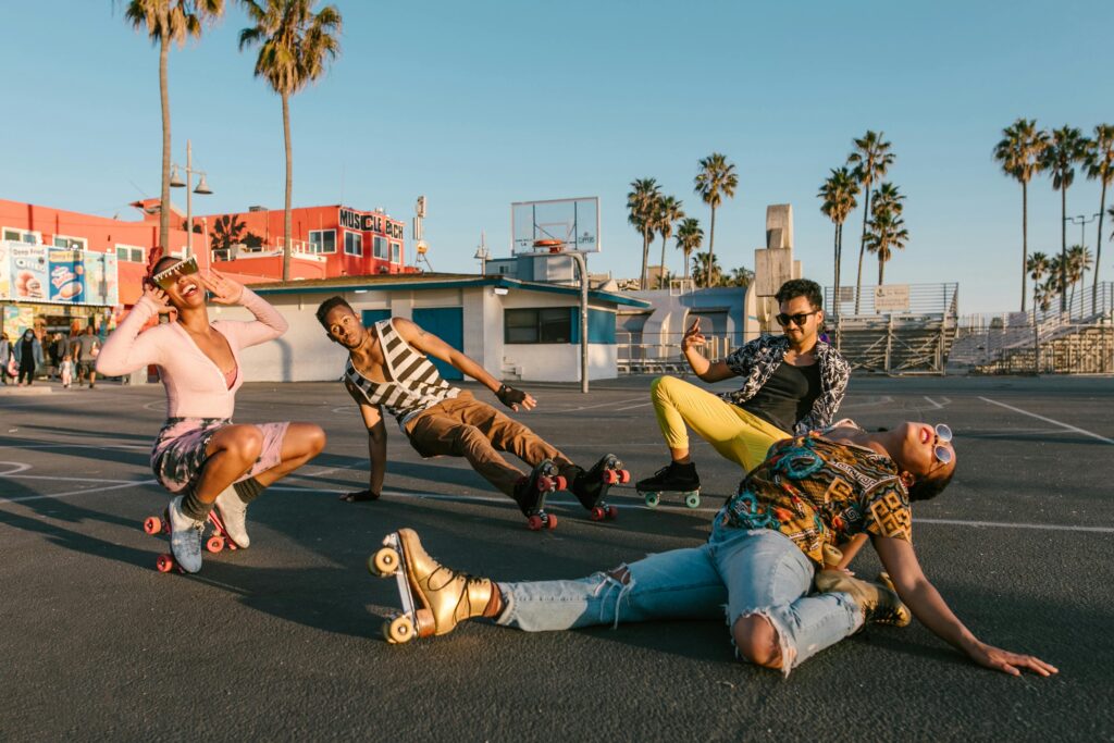 Young people in various poses and in colourful clothes and their roller skates. Connected to blog post on Gen Z sayings and slang.