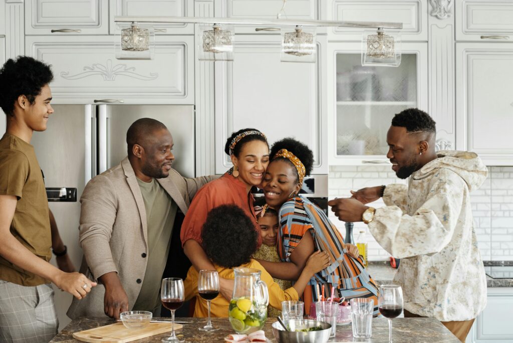 Supportive big black family in the kitchen - related to blog post on how to stop being a perfectionist parent