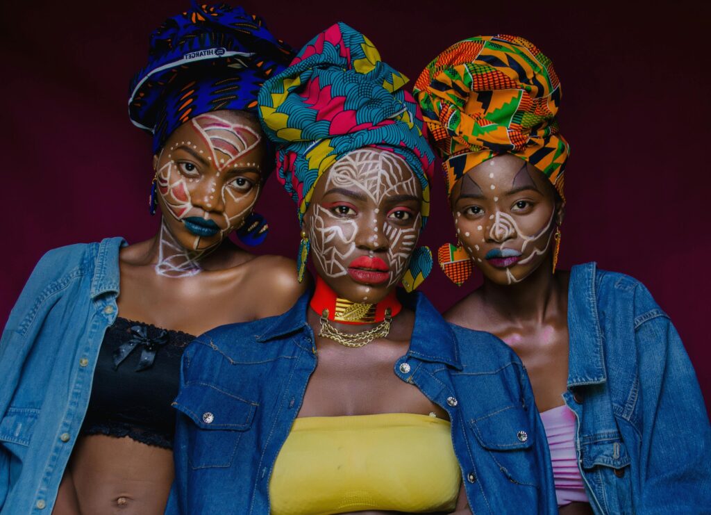 3 African women in traditional outfits - a safe space for black women