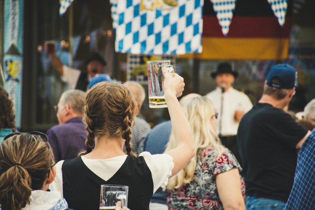 European Cuisine - Oktoberfest - Potato Europe - Beer Europe - Picture of woman with braids at Oktoberfest
