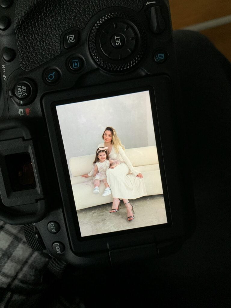 a picture of a mother and daughter in a camera - related to blog post on how to stop being a perfectionist parent