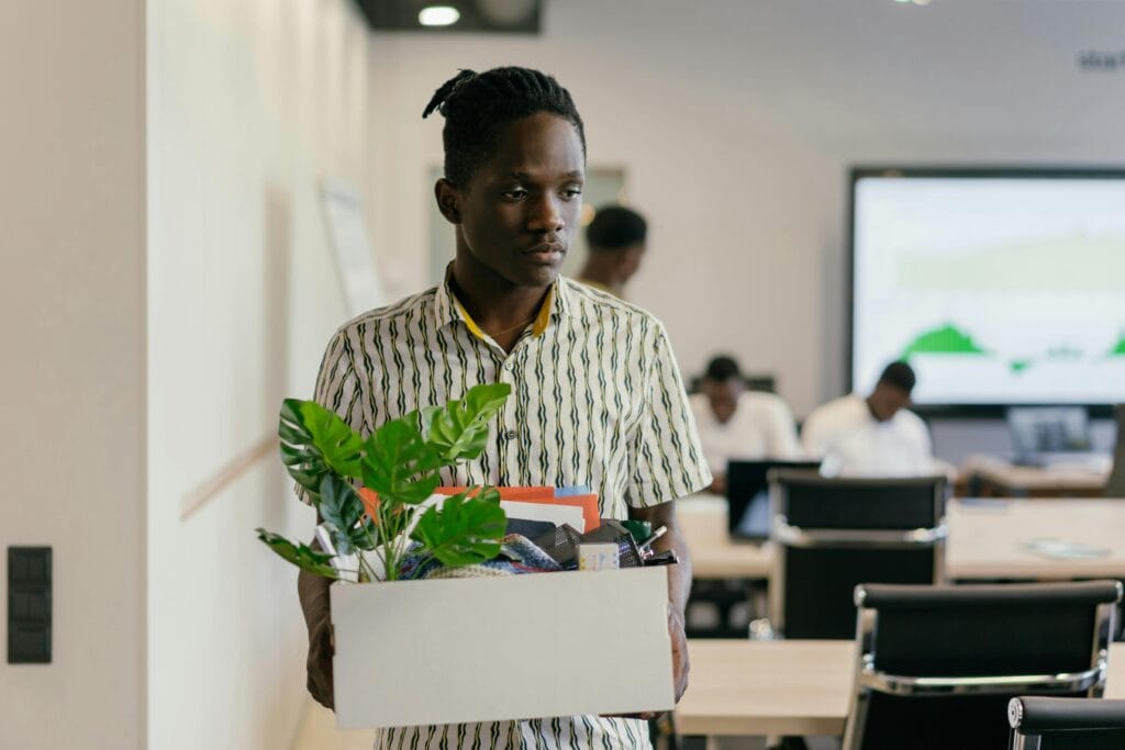 Man carrying his belongings in the office